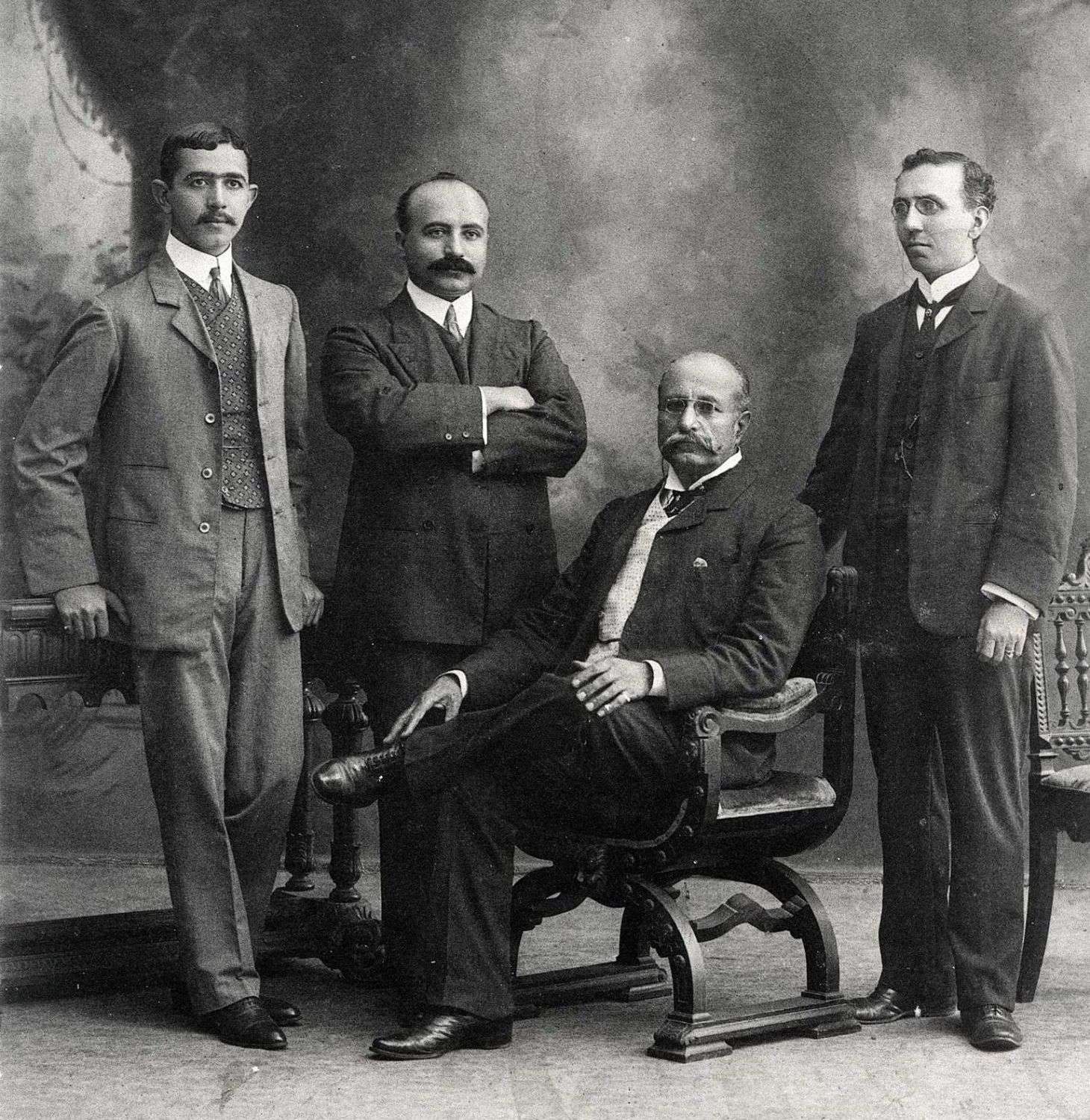 Martin Sarkies (seated) with his manager Joe Constantine (left),his brother Arshak and Martyrose Arathoon, a Sarkies partner (right).
